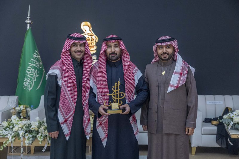 Dr. Alsaleh with two colleagues at the ceremony